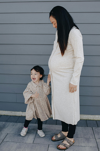 pregnant mom and young daughter